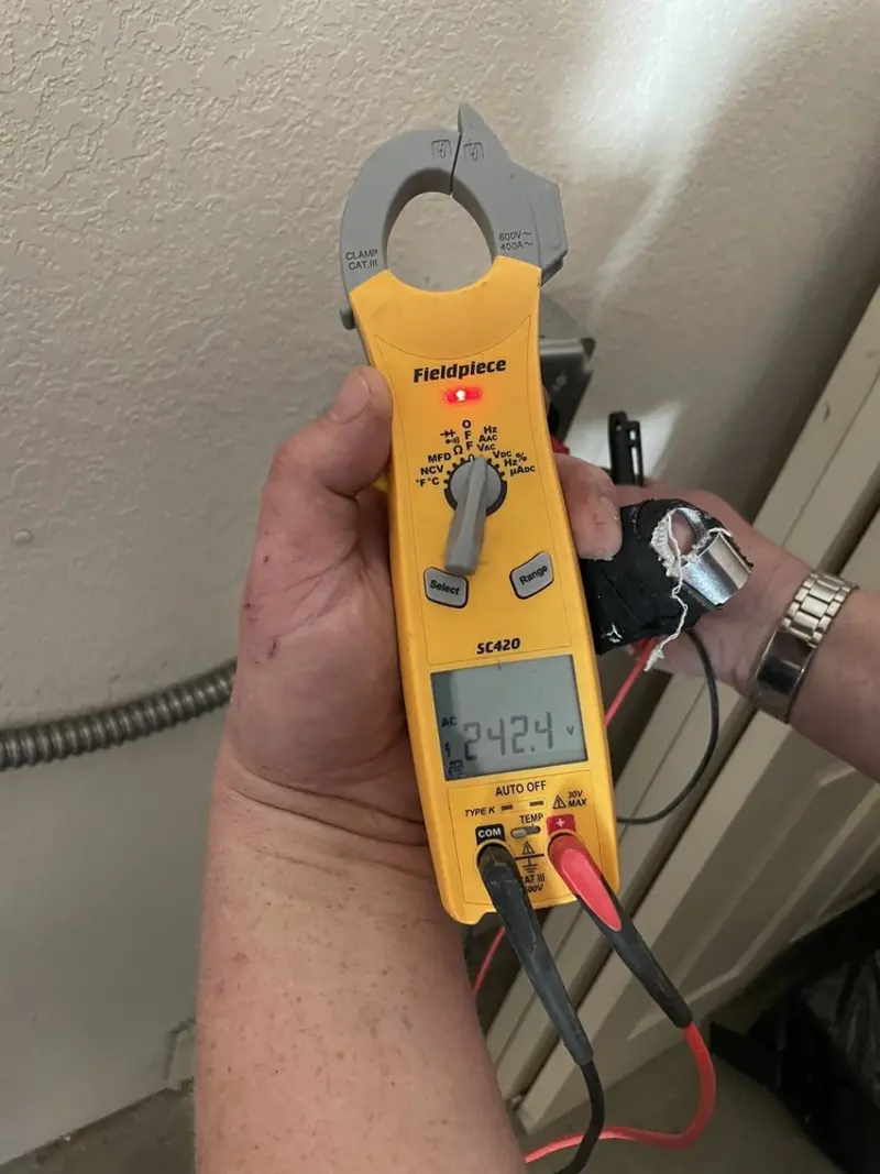 Voltage testing with clamp meter during Electrical Installation Services in Meadville